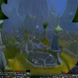 9: A city of stone towers and stone paths, in a green landscape with mountains in the background, viewed from a distance and from above.